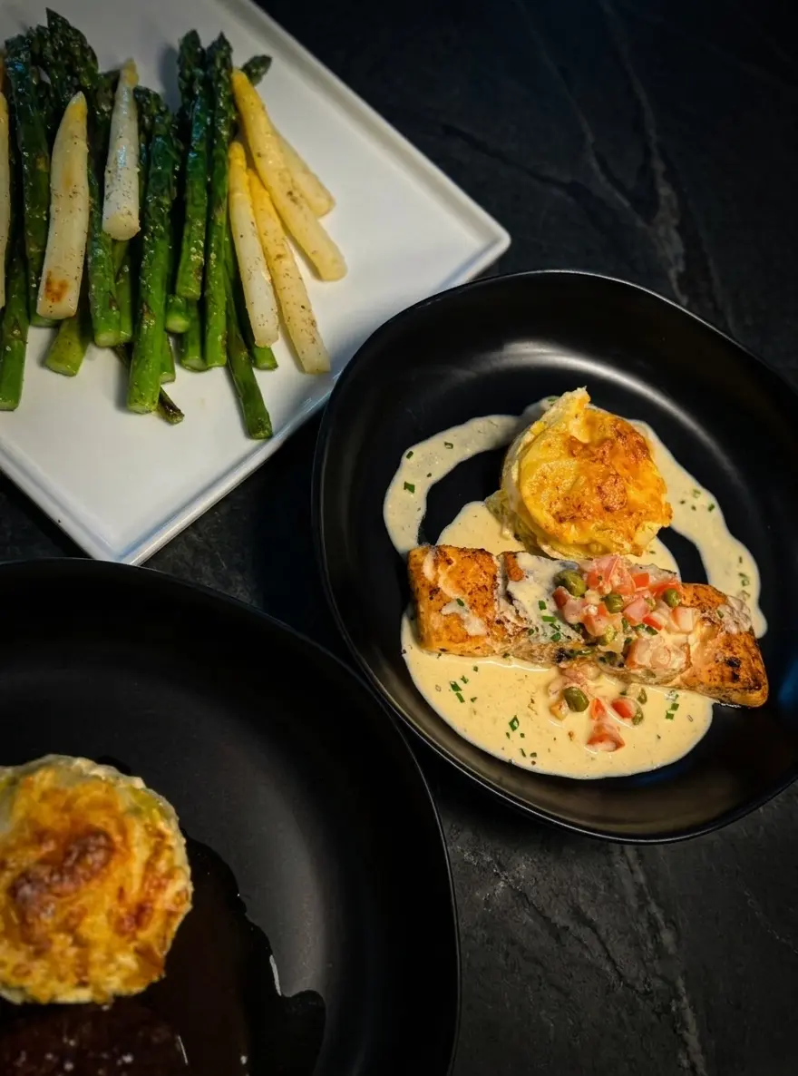 Pan-seared salmon served as a refined plated dish.